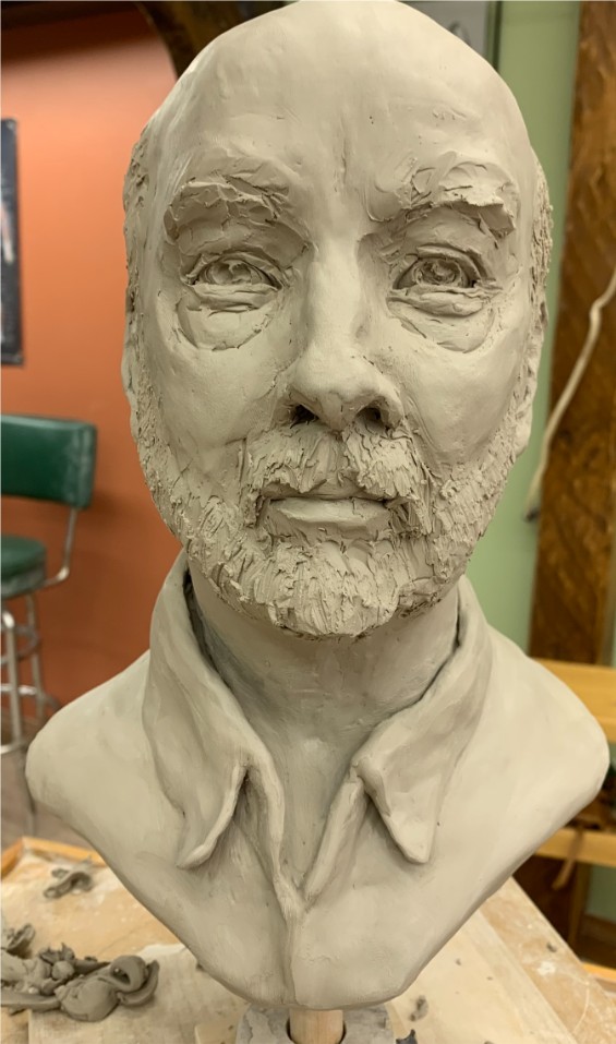 Clay sculpture of a mans bust